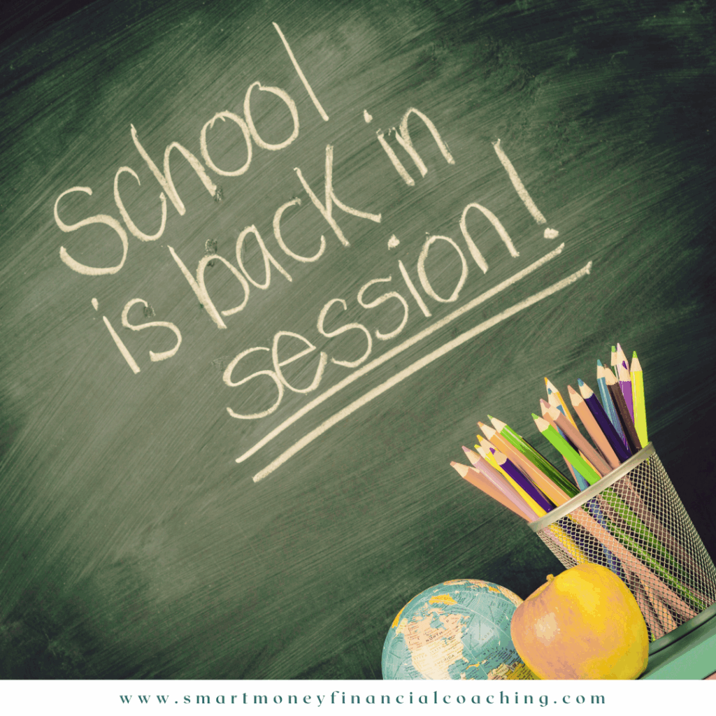 School is back in session written on chalkboard with globe, apple, and pencils — Smart Money Financial Coaching