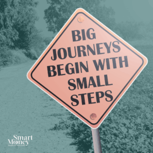 A road sign that says “Big Journeys Begin with Small Steps,” symbolizing financial progress through reflection and small, consistent actions.